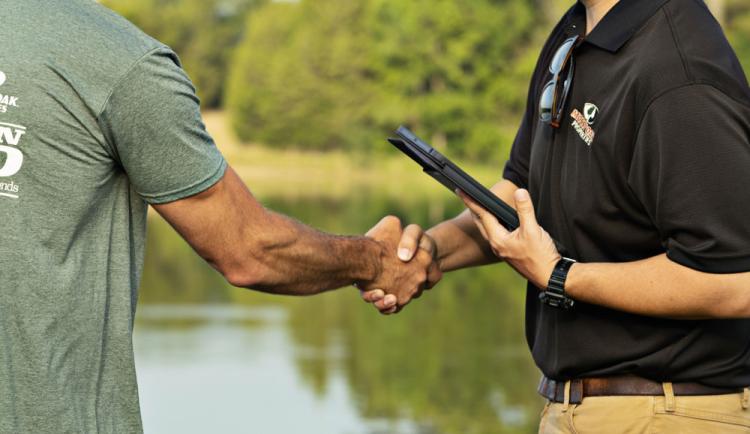 Land Guy shaking hands