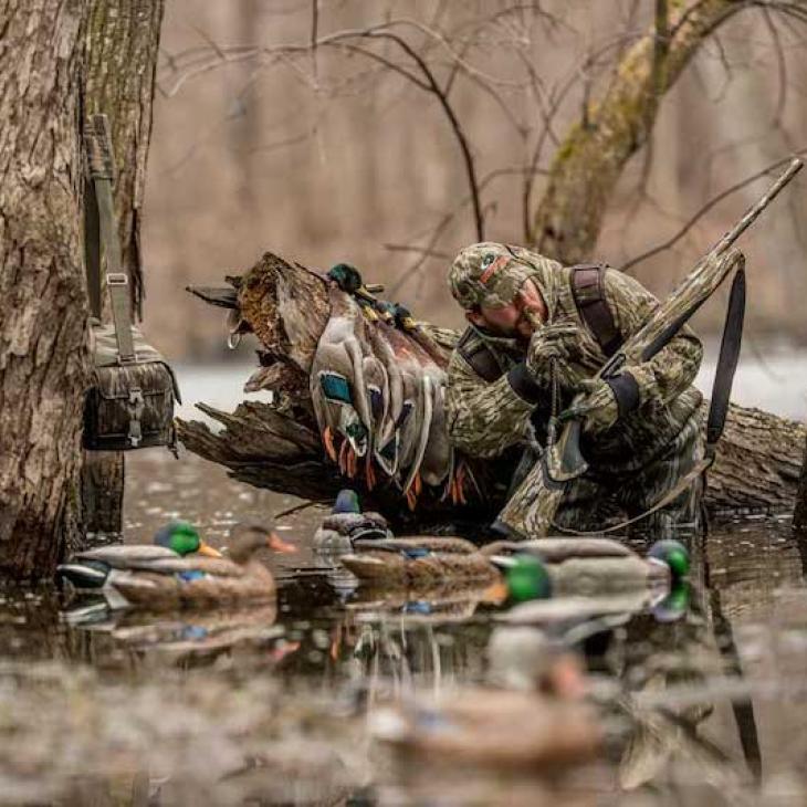 duck-hunter-with-mallards