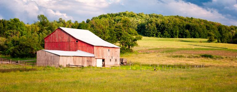 Photo of old, weathered barn on farm.