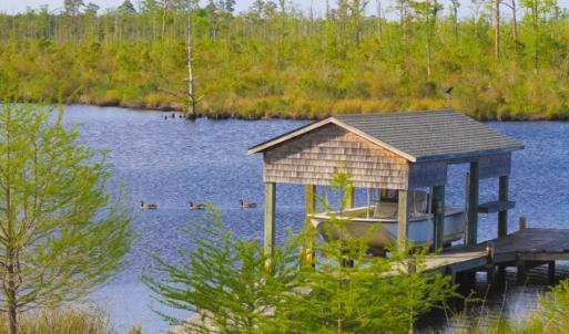 Photo of UNDER CONTRACT!  Waterfront Home with 11 Acres of Land For Sale in Tyrrell County NC!