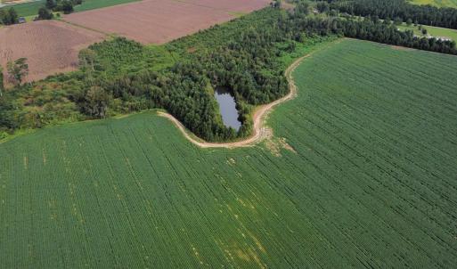 Aerial view of property's location with farmland,