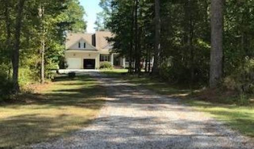 Private home setting on wooded lot