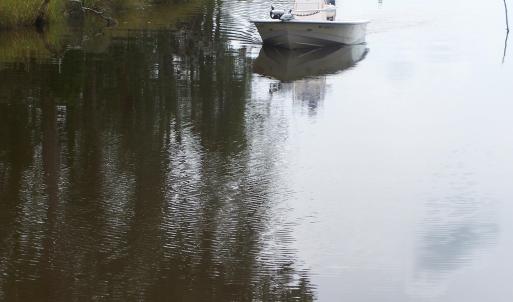 Boat navigating Mill Creek