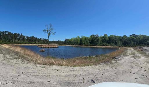 Pond with drivable roadway around