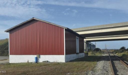 enclosed building next to railroad