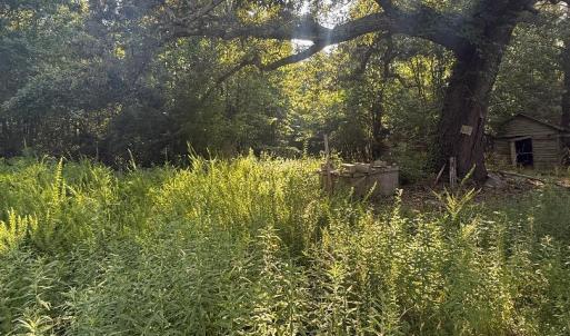 area to left of old home with well and o