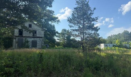 view from road facing uninhabitable home