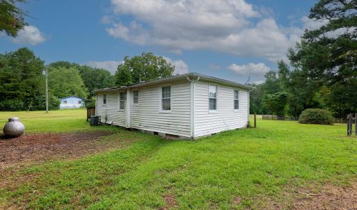 rear of uninhabitable home on property