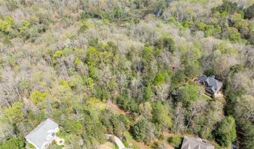 Aerial view of property from above cul de sac looking east