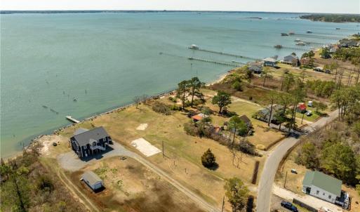 Concrete pad for 3 bay garage, riprap, boatramp, well &septic all in place