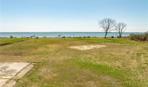 Concrete pad for 3 bay garage, riprap, boat ramp, well and septic all in place