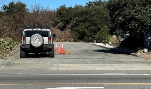 Please park here and walk the site.
