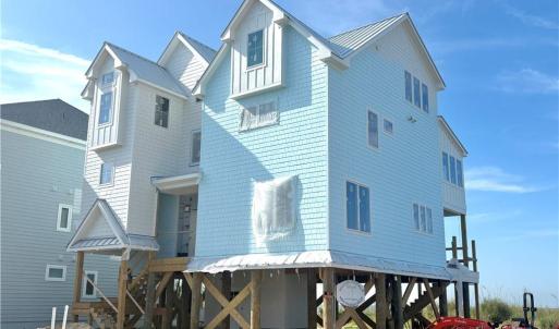 New construction home being built on neighboring lot