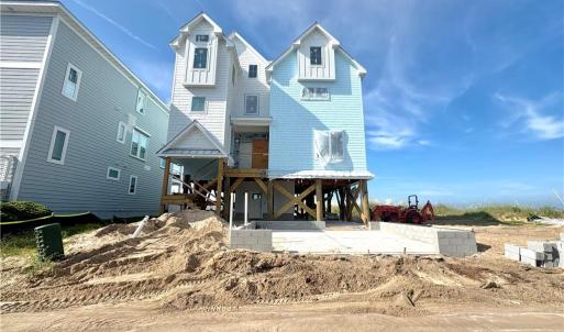 New construction home being built on neighboring lot