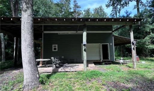Two story barn with great deck upstairs.