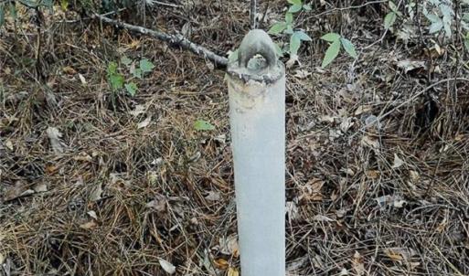 To the left of the land