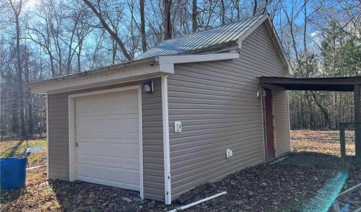 Utility shed with agricultural well and on stall horse barn.