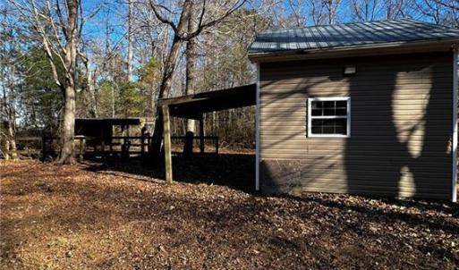 Utility shed with agricultural well and on stall horse barn.