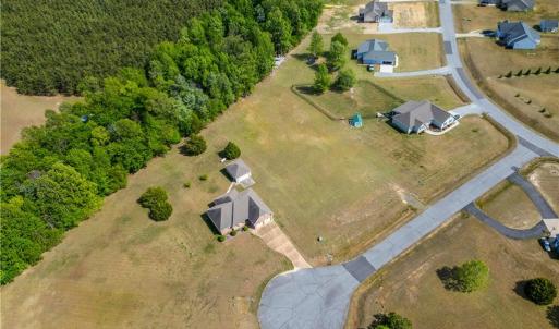 View from the land showing some other homes in this established Bethel Farms community.