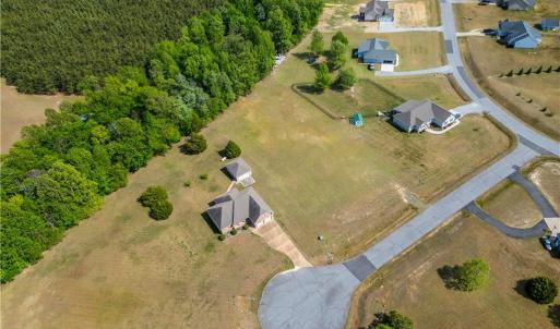 View from the land showing some other homes in this established Bethel Farms community.