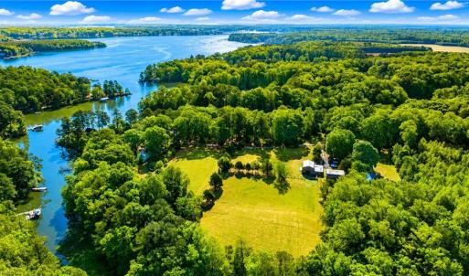 Overview of land with water frontage through small tree line