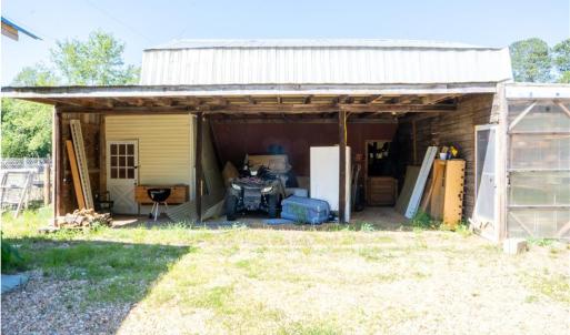 Additional storage beside the barn under cover
