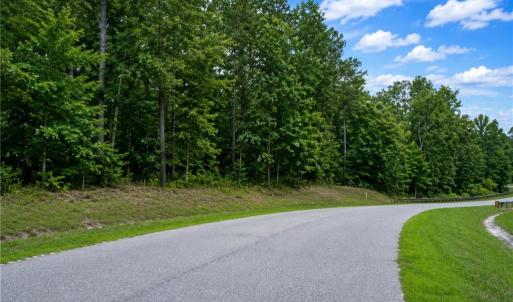 Lot is along the left side of the road with the creek portion down where the guardrails are seen