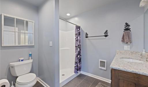 Full bath to right of kitchen and separate utility closet with washer/dryer/water heater.
