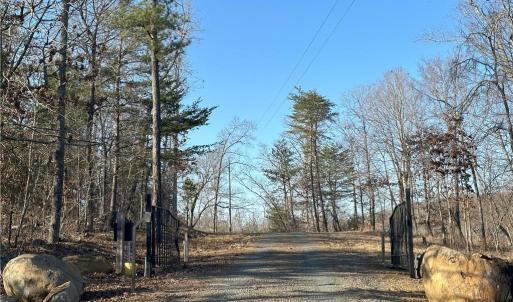 Property line runs along powerlines and you'll see purple end stakes for estimated lines.