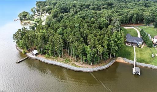 Waterfront lot begins just to the left of the home on the right.