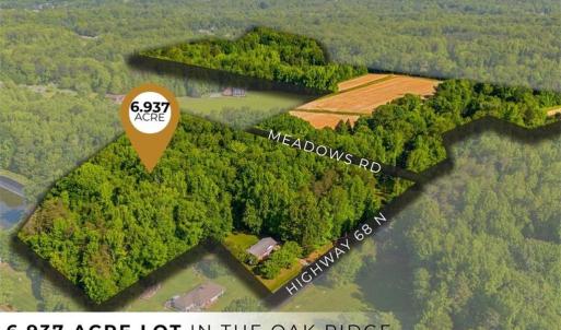 Prime dual-frontage opportunity! This 6.937-acre tract offers multiple access points and unbeatable positioning just a stone's throw from the Oak Ridge Town Park.