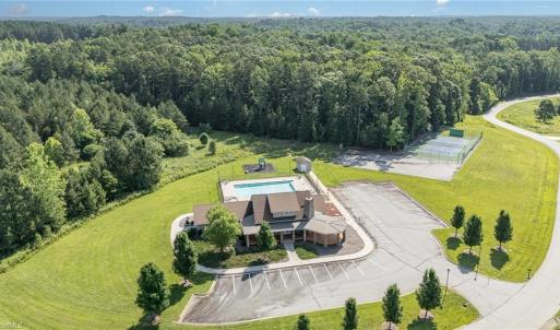 Clubhouse with pool, tennis courts, and basketball