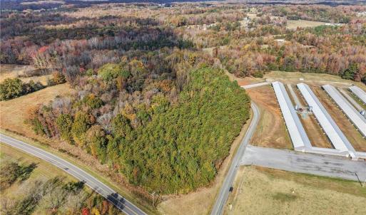Aerial view of vacant land and farm land. Lot lines and dimensions are approximate.