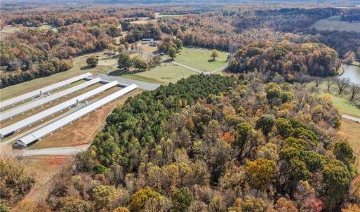 Aerial view of vacant land and farm. Lot lines and dimensions are approximate.