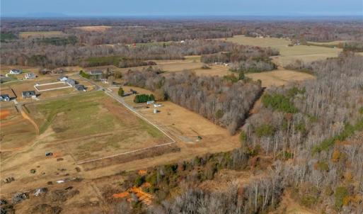 Left and back side of property is defined by a natural tree line.