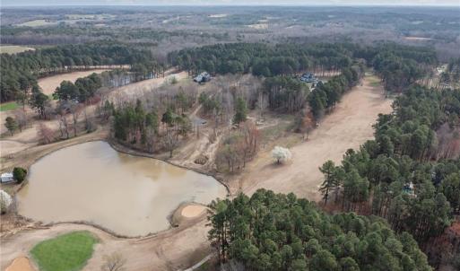 Aerial view of the 18th green and fairway, Lot 54 is in the middle of the photo at teh back of the lake.