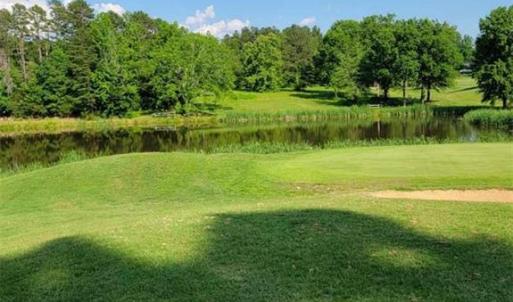Seller photo of LOT 54 as seen just past the 18th green during the summer.