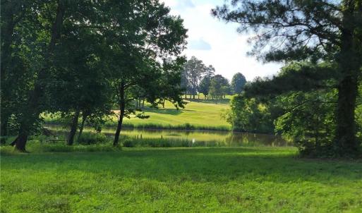 Seller photo of LOT 54 of Caswell Pines Golf Course in summer.