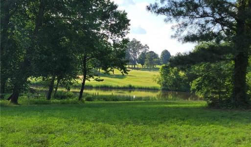Seller photo of LOT 54 of Caswell Pines Golf Course in summer.