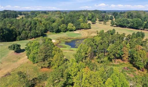 Aerial view of Lot 54 Caswell Pines with the lake behind it.