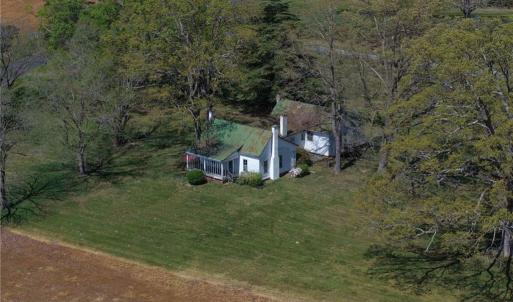 Farmhouse has a screened in side porch
