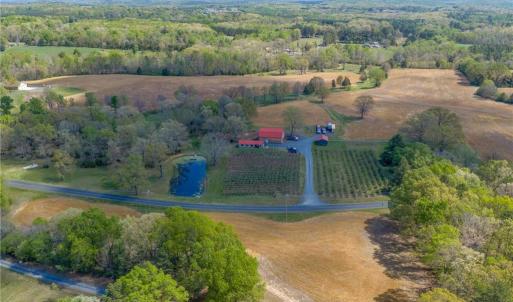 54.04 private acres with pond, creek, and existing agricultural infrastructure