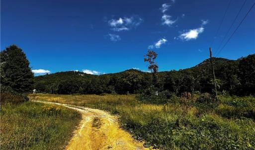 Reid Rd is a private, dirt/gravel drive.
