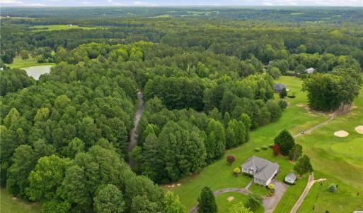 Aerial view of the property (lot 24) and 115 Oak Tree Drive to Club House Drive.