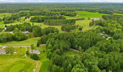 Aerial view of the neighborhood and the golf course lot.