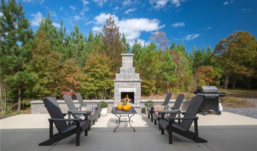 Concrete block fireplace w/ built-in bench wall