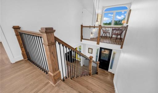 2 story foyer w/ hanging decorative ball light fixtures