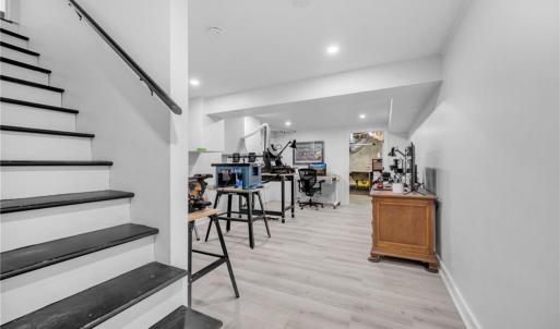 Finished basement area, perfect for workshop/craft area