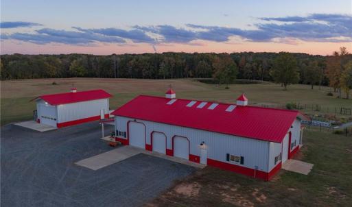 Equipment building w/ attached covered porches, built by Morton Buildings, 4 motorized garage doors, and ample space for equipment, storage, or hobby use