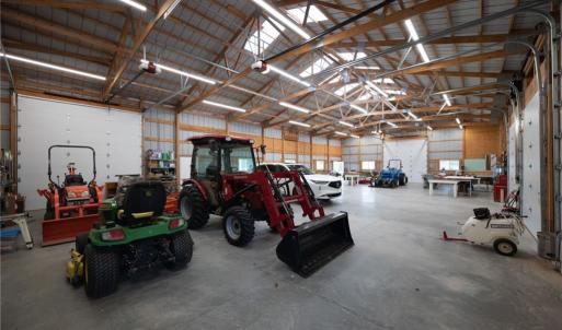Interior of equipment building, 2 door entrances, and 4 motorized garage doors